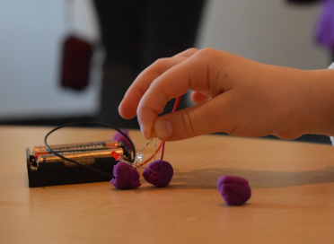 child creating electricity