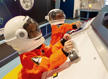 children is astronaut suits 