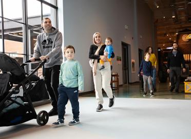 Family walks through exhibit