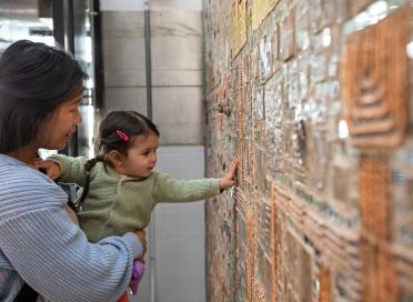 Child feeling mosaic wall